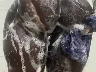 Brief-haired Nigerian hottie gets drenching humid with sheer pleasure in a red-hot douche