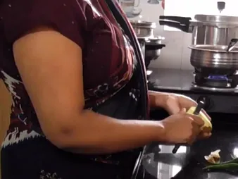 Stepson plows YourDisha's Indian pussy concerning an obstacle kitchen with his broad in the beam cock